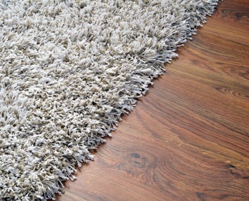 White Carpet on brown Wooden Floor