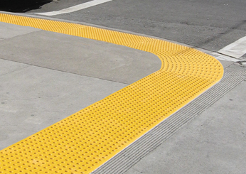 Yellow Tradius Tactile System on Curb