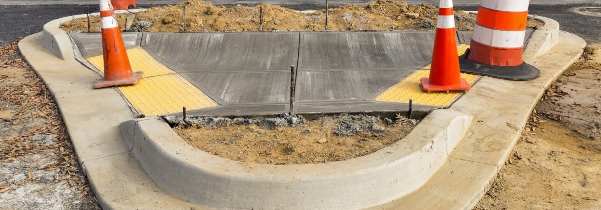 wet concrete on new sidewalk construction