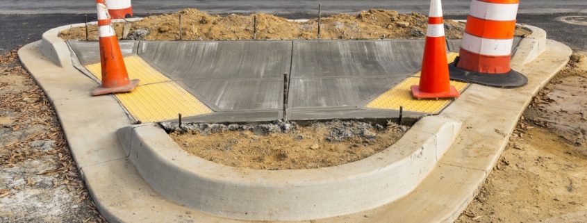 wet concrete on new sidewalk construction