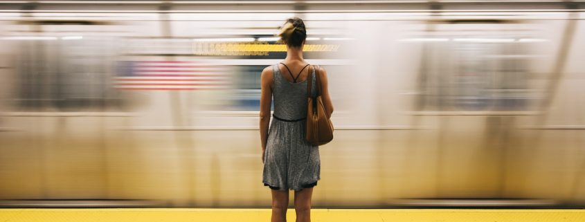 Blind female passenger waiting for a subway train
