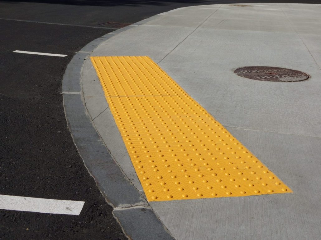 tactile paving with textured ground surface with markings