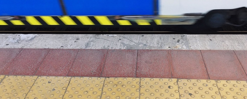 Tactile Paving On Railroad Station Platform By Train