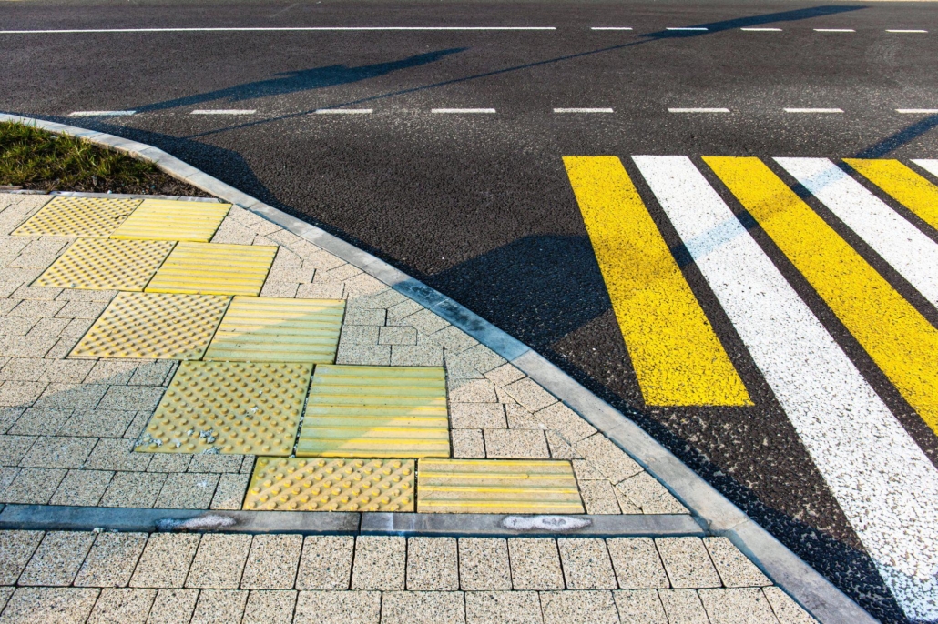 tactile tile for the blind before a pedestrian crossing on a city street
