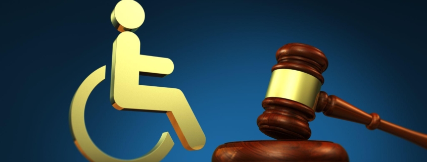 social services and legal acts for disabled people concept with a judge gavel and a wheelchair icon 3D illustration
